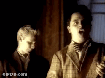 Man In Suit Singing Into Microphone GIF