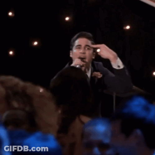 Man In Suit Singing Into Microphone GIF