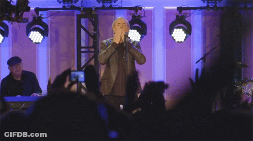 Man In Suit Singing Into Microphone GIF
