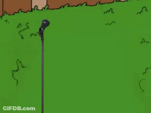 Man In Suit Singing Into Microphone GIF