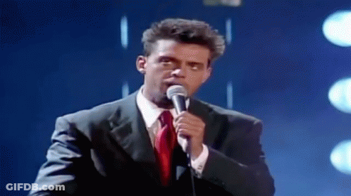 Man In Suit Singing Into Microphone GIF