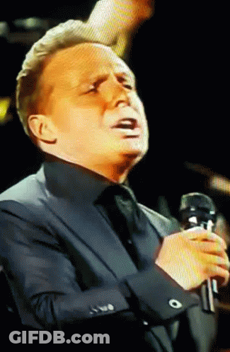Man In Suit Singing Into Microphone Eyes Closed GIF