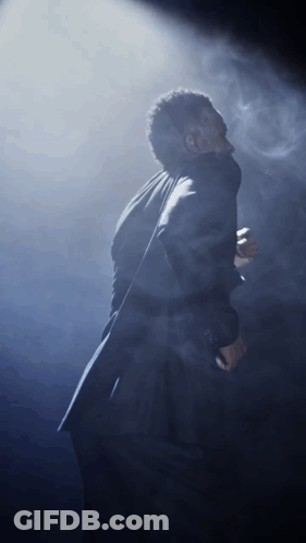 Man In Suit Singing Into Microphone GIF