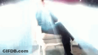 Man In Suit Singing Into Microphone GIF