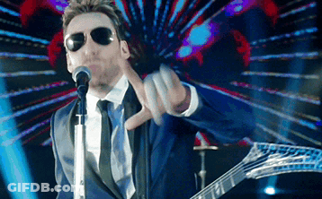 Man In Suit Singing Into Microphone GIF