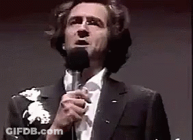 Man In Suit Singing Into Microphone GIF