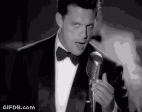 Man In Suit Singing Into Microphone GIF