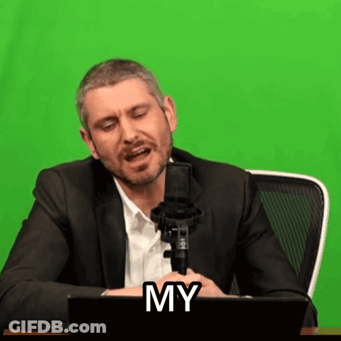 Man In Suit Singing Into Microphone With Word My GIF