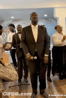 Man In Suit Singing Into Microphone GIF