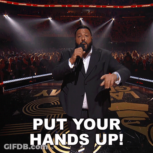 Man In Suit Singing Put Your Hands Up GIF