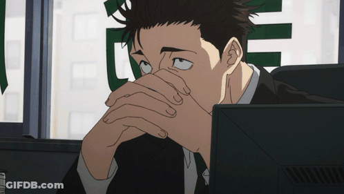 Man In Suit Sitting At Computer GIF