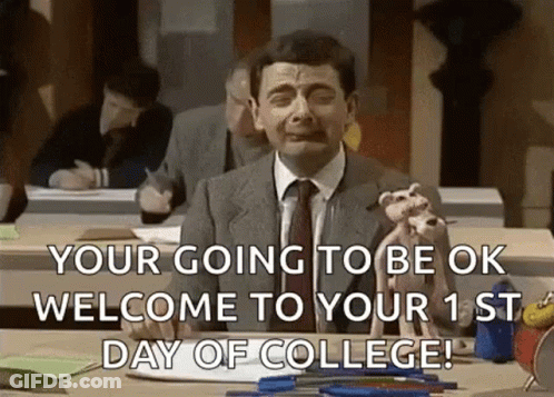 Man In Suit Sitting At Desk Holding Dog GIF