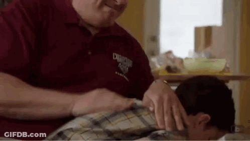 Man In Suit Sitting At Desk GIF