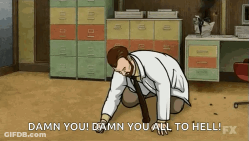 Man In Suit Sitting At Desk GIF