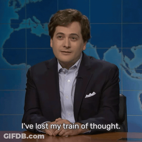 Man In Suit Sitting At Desk Says I've Lost My Train Of Thought GIF