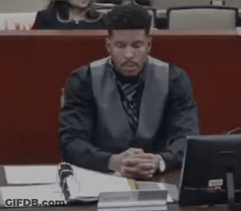 Man In Suit Sitting At Desk With Computer GIF