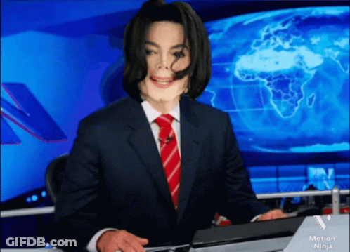 Man In Suit Sitting At Desk With Motion Ninja Logo GIF