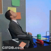 Man In Suit Sitting At Desk With Soda GIF