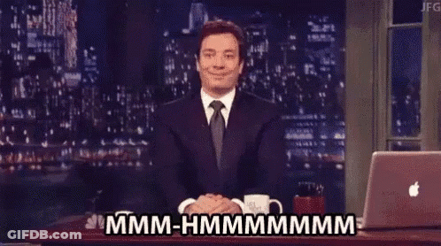 Man In Suit Sitting At Laptop Says Mmmm-Hmmmmmmmm GIF