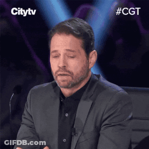 Man In Suit Sitting At Microphone Eyes Closed GIF