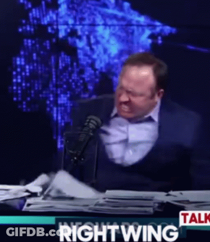 Man In Suit Sitting At Microphone Saying Rightwing Talk GIF
