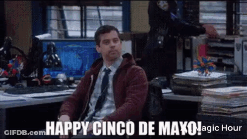 Man In Suit Sitting At Police Desk GIF