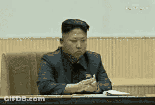 Man In Suit Sitting At Table GIF