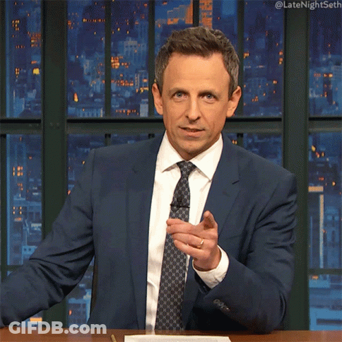 Man In Suit Sitting At Table #Latenightseth GIF