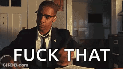 Man In Suit Sitting At Table With Book Saying Fuck That GIF