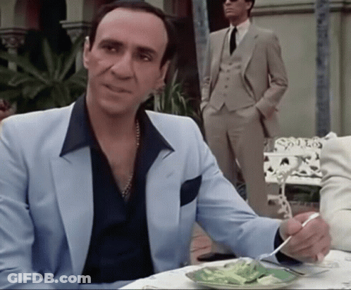 Man In Suit Sitting At Table With Food GIF