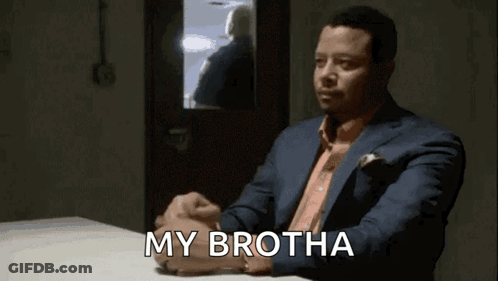 Man In Suit Sitting At Table With My Brotha GIF