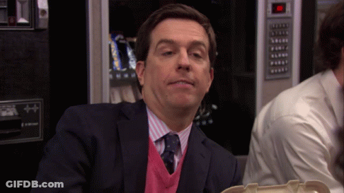 Man In Suit Sitting At Vending Machine GIF