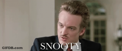 Man In Suit Sitting Before Snooty Wall GIF