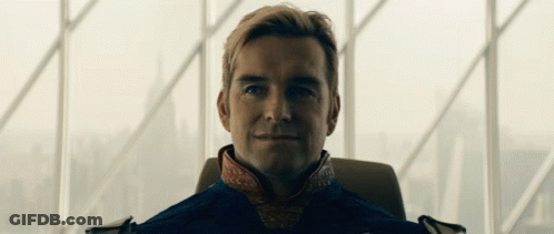 Man In Suit Sitting By Large Window GIF