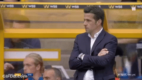 Man In Suit Sitting Crossed Arms GIF