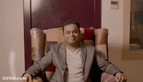 Man In Suit Sitting Crossed Arms GIF