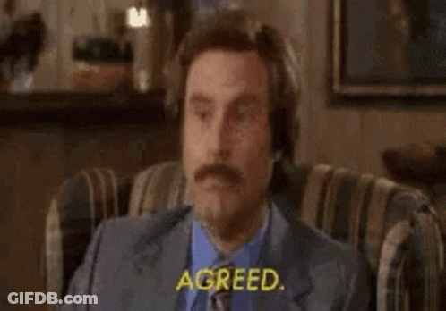 Man In Suit Sitting Eyes Closed Saying Agreed GIF
