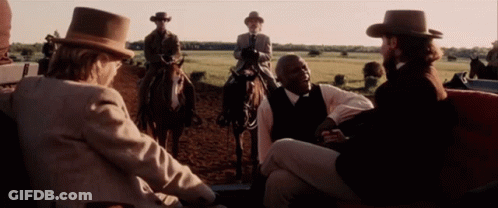 Man In Suit Sitting Eyes Closed Smiling GIF