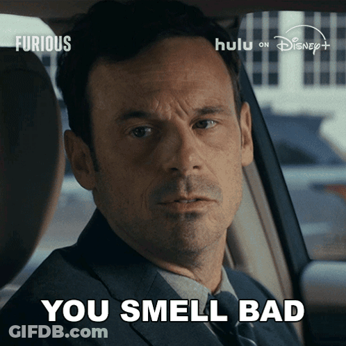 Man In Suit Sitting In Car Says You Smell Bad GIF