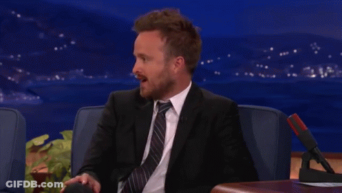 Man In Suit Sitting In Chair GIF