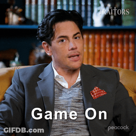 Man In Suit Sitting In Chair Saying Game On GIF