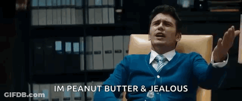 Man In Suit Sitting In Chair Talking GIF