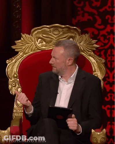 Man In Suit Sitting In Chair Taskmaster GIF