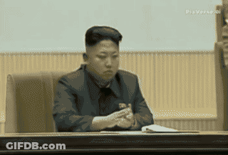 Man In Suit Sitting In Front Of Another Man GIF