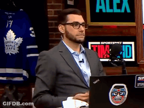 Man In Suit Sitting In Front Of Laptop With Toronto Maple Leafs Jersey GIF