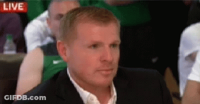 Man In Suit Sitting In Front Of Live Screen GIF