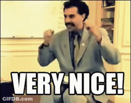Man In Suit Sitting In Front Of Whiteboard Saying Very Nice GIF