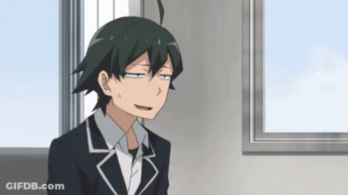 Man In Suit Sitting In Front Of Window Making Funny Face GIF