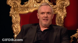 Man In Suit Sitting In Gold Frame Chair GIF