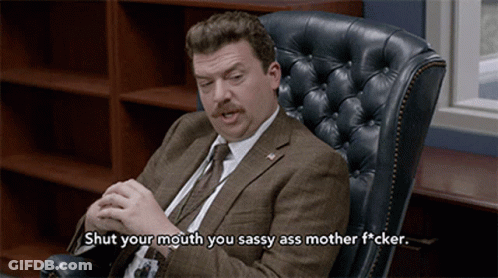 Man In Suit Sitting In Leather Chair Saying Shut Your Mouth You Sassy Ass Mother F*cker GIF